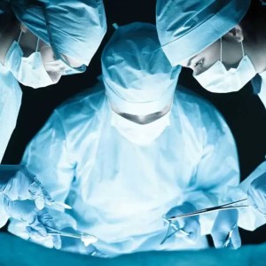 Image of 3 SMU students in an operating room