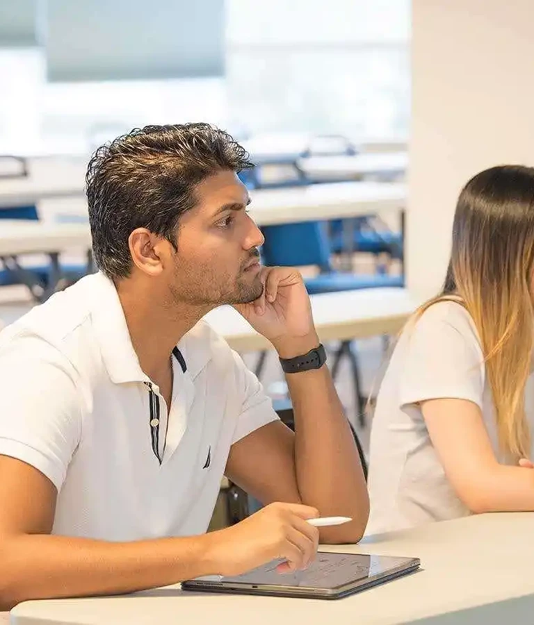 SMU Medical student listening closely during class