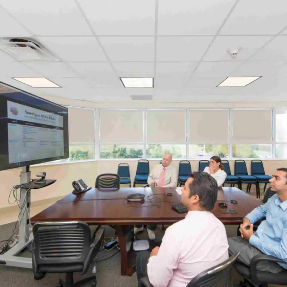 SMU Faculty members working in conference room