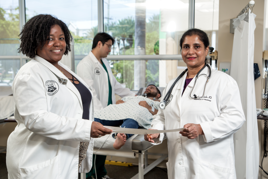 Image of two female medical students in a lab