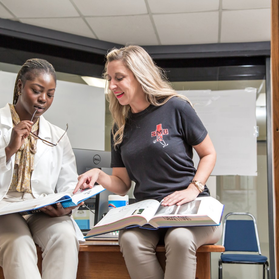 St. Matthew's University School of Medicines studying together in library