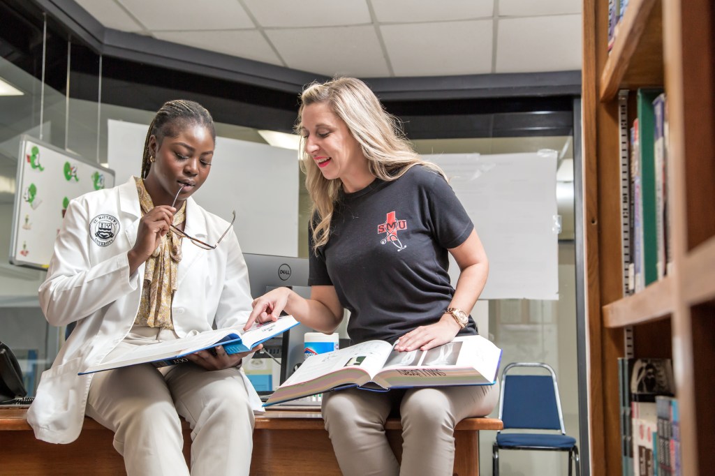 St. Matthew's University School of Medicines studying together in library