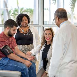 St. Matthew's University School of Medicine students receive feedback from faculty member