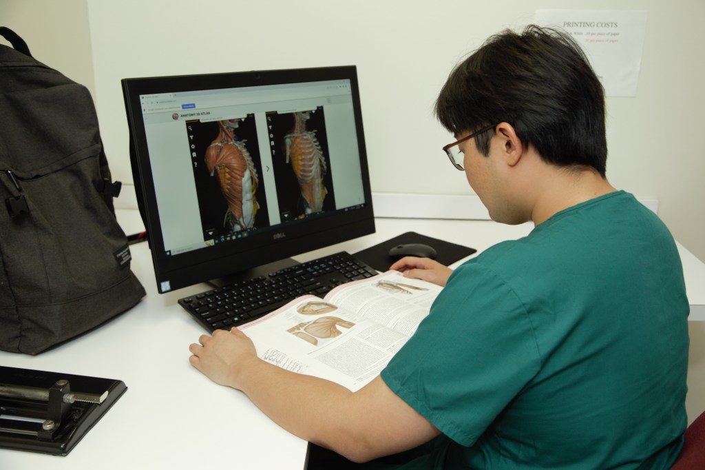 SMU Medical Student studying in library