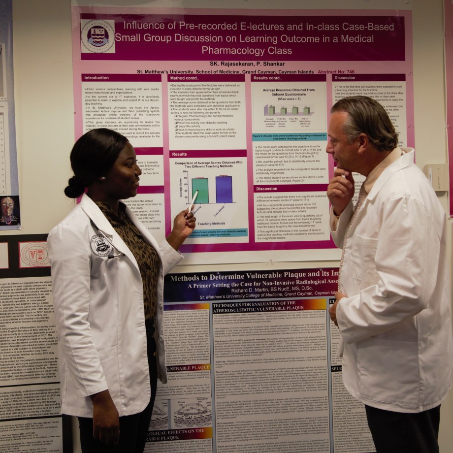 SMU Medical student shares her research project with faculty member
