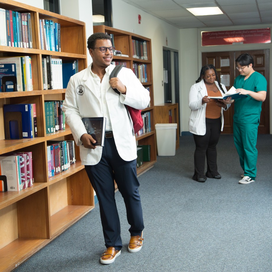 St. Matthew's University School of Medicine students working in library