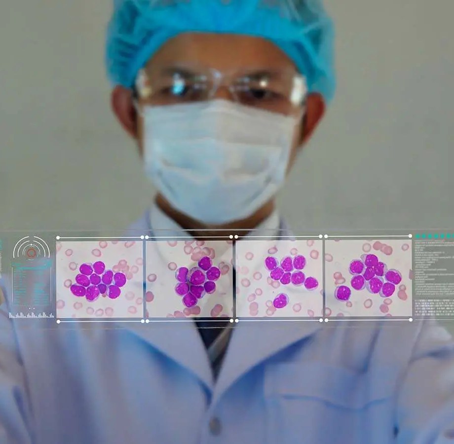 Medical student reviewing microbiology slide