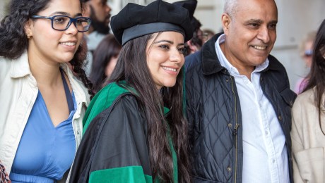 New SMU Medical graduate enjoying commencement with family