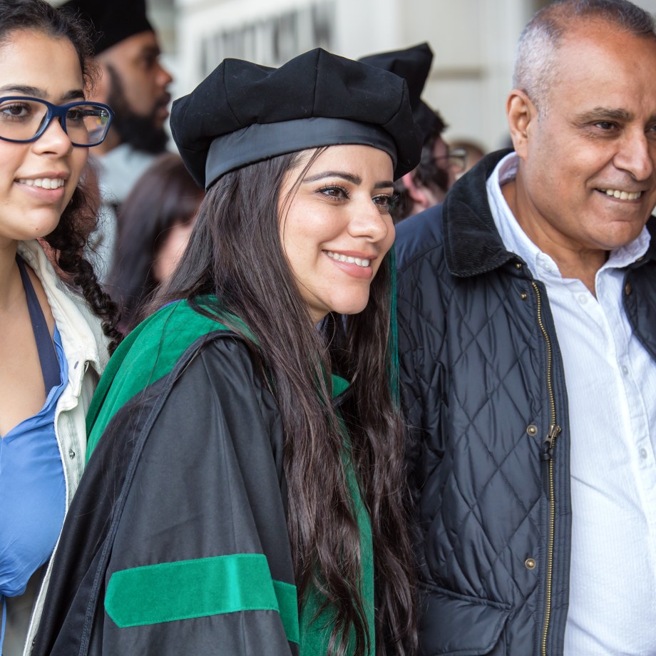 New SMU Medical graduate enjoying commencement with family